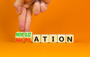 Mobilization or manipulation symbol. Concept words Mobilization Manipulation on wooden cubes....