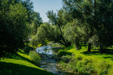 Blue laguna clean water canal river in small city in Latvia, Baltic States