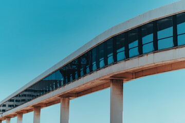 Pedestrian overpass on blue sky background