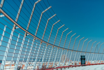 Fencing on roof of skyscraper with view on the city