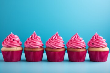 
A wallpaper or neatly aligned pink cupcakes on blue background. Sweet composition concept. Generative AI
