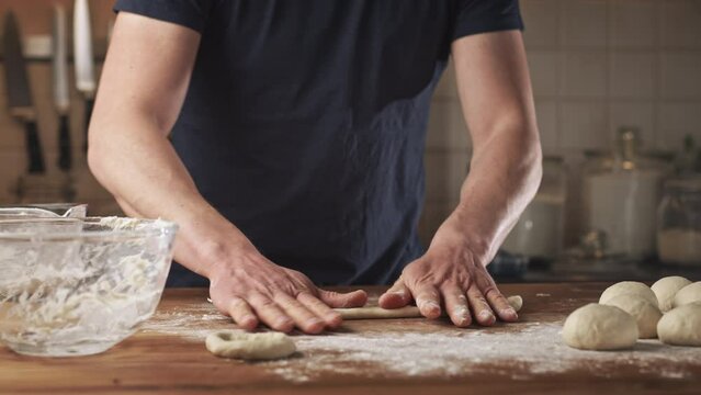 Home baking - making fresh Greek bagels or koulouri of Thessaloniki.