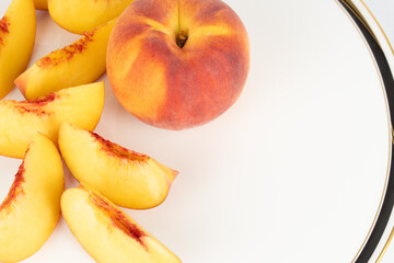 Sliced peaches on fancy plate