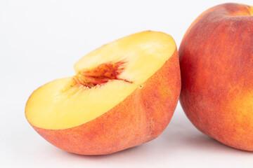 Sliced half peach no pit white background