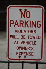no parking sign violators will be towed at vehicle owener's expense