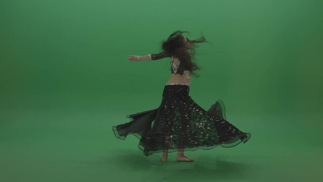 Appealing belly dancer in black wear display amazing dance moves over chromakey background
