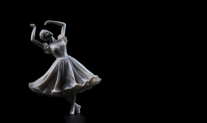 Statuette of a girl dancer, plaster, white figure, goddess of beauty on a black background. copy space