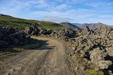 A view of the dirt road among the lava fields. Helgafellssveit, Iceland.