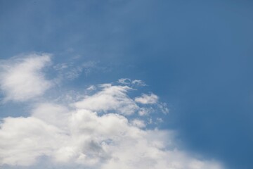 White clouds and blue sky background on daylight, copy space