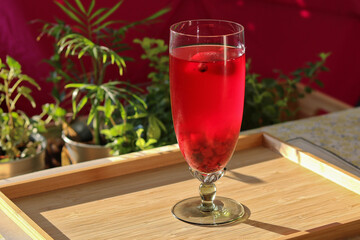 Homemade lemonade with garden fruits, strawberries and currants
