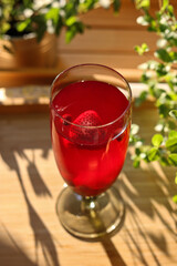 Summer lemonade with garden fruits, strawberries and currants