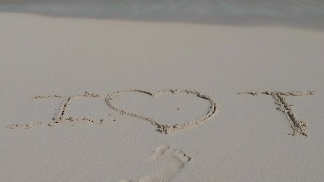 Dive into the 'Tropical Serenity: I Love T on the Beach' video. T-shaped artistry on tranquil shores, perfect for heartfelt projects and capturing affection by the coast