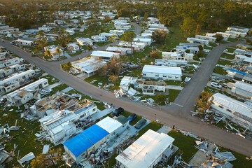 Destroyed by hurricane Ian suburban houses in Florida mobile home residential area. Consequences of...