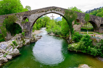 Fototapeta na wymiar Cangas de Onis, mountain village with old roman ruins and bridge, Picos de Europa mountains, Asturias, North of Spain
