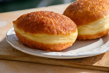 Fried in oil french stuffed with apples or chocolate beignets donuts pastry, sweet dessert served outdoor