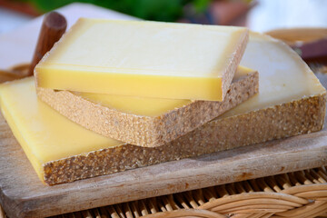 French cheese Comte, three varieties 1 year matured Prestige, fruity flavoured Fruite and Vieille Reserve close up