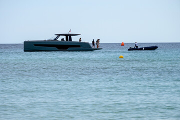 Crystal clear blue water of legendary Pampelonne beach near Saint-Tropez, summer vacation on white sandy beach of French Riviera, France