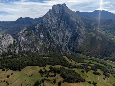 Aerial views of green Liebana valley, houses and mountains,  comarca of Cantabria, Spain