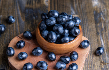 Unwashed blue grapes in the dust