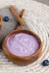 Fototapeta na wymiar blueberry yogurt with the addition of ripe blueberries