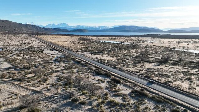 Patagonia Road At Puerto Natales In Ultima Esperanza Chile. Snowy Mountains. Road Landscape. Ultima Esperanza Chile. Winter Background. Patagonia Road At Puerto Natales In Ultima Esperanza Chile.