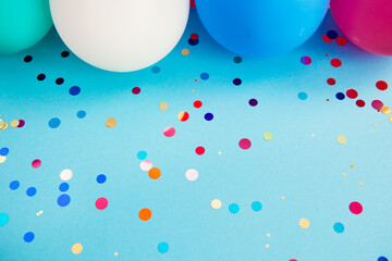 Vibrant blue background with glittering confetti and air balloons, card for celebration art with copy space