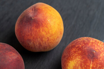 ripe delicious and fresh peaches of a red hue
