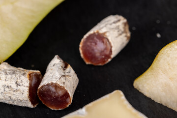 dried sausage with white mold cut into small pieces