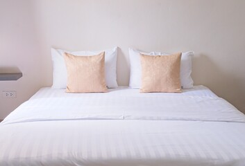 white cozy bedroom, decor idea and design, home interior decoration light brown pillow front view