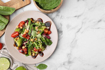 Tasty salad with balsamic vinegar on white marble table, flat lay. Space for text