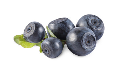 Delicious ripe bilberries and green leaves isolated on white