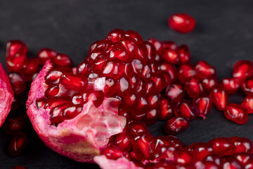Grains of red ripe pomegranate close up