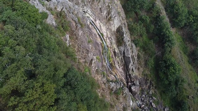 Aerial view over "Frecha da Mizarela" waterfall - the largest waterfall on the Iberian Peninsula. Serra da Freita, Portugal 2023.