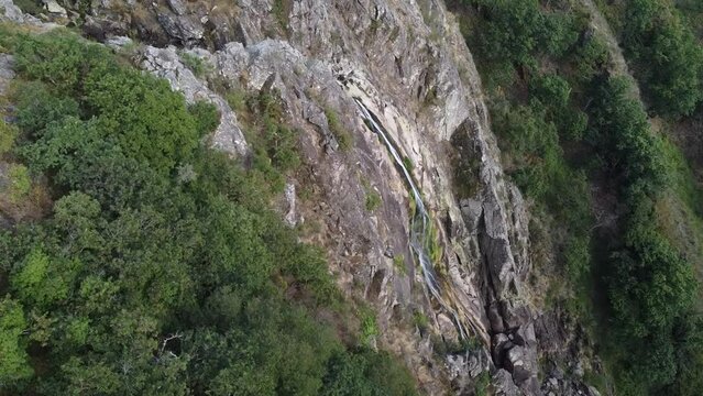 Aerial view over "Frecha da Mizarela" waterfall - the largest waterfall on the Iberian Peninsula. Serra da Freita, Portugal 2023.