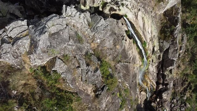 Aerial view over "Frecha da Mizarela" waterfall - the largest waterfall on the Iberian Peninsula. Serra da Freita, Portugal 2023.