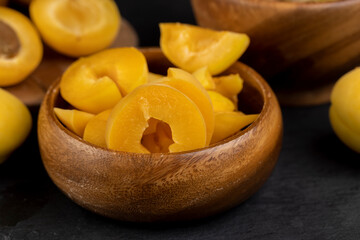 ripe yellow apricots on the table close-up