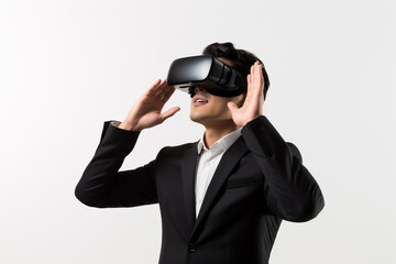 Young man wearing virtual reality VR glasses, VR headset and trying to touch something with his hand while standing on white background.