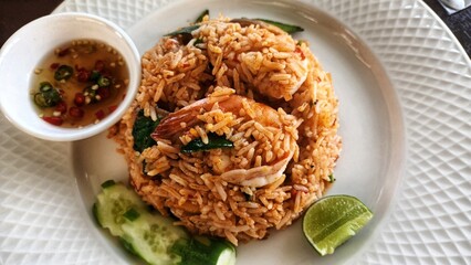 Fried rice with chili paste in a white plate, spicy Thai food 