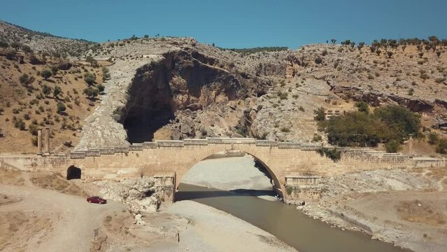 Aerial view of Severan Bridge and Chabinas creek at Adiyaman province, southeastern Anatolia, Turkey. Cendere bridge or Chabinas bridge is a late Roman bridge located near the ancient city of Arsameia
