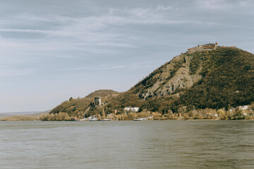 Naklejka premium landscape shot of castle visegrad on a mountain in the danube knee in Hungary as seen from the north during midday sun in vintage colors