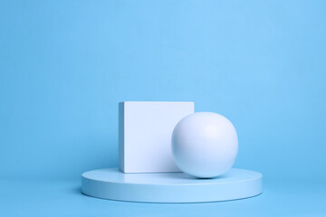 Abstract composition of rectangle and white sphere on cylinder pedestal over blue pastel color. 