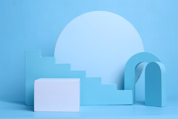Exhibition podium, platform for product presentation on pastel blue background