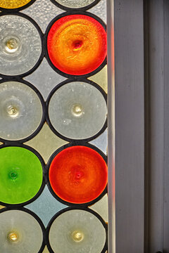 colorful stained window glass consisting of circular shapes