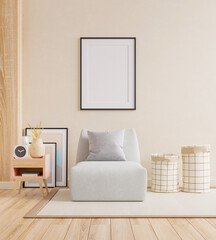 Poster mockup with vertical black frame and armchair in home interior background.