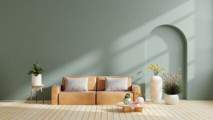 Modern minimalist interior with leather sofa on empty dark green color wall background.