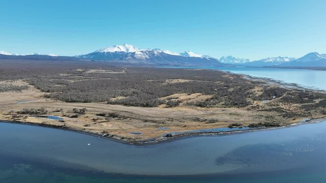 Patagonia Lake At Puerto Natales In Ultima Esperanza Chile. Snowy Mountains. Lake Landscape. Ultima Esperanza Chile. Winter Background. Patagonia Lake At Puerto Natales In Ultima Esperanza Chile.