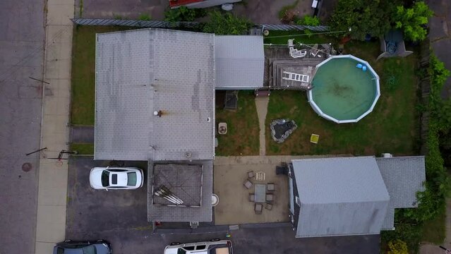 Aerial Top View Shot Of Street Amidst Houses In City, Drone Flying Upward Over Residential District - Boston, Massachusetts