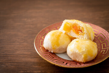 Chinese pastry moon cake with salted egg peanut or Spring Roll pastry with nuts and salted eggs