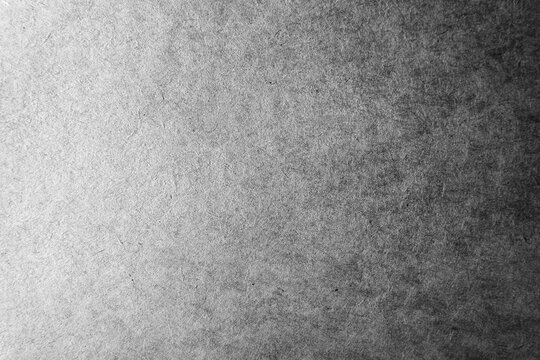 Blank pale black or grey color gradation with dark tone paint on environmental friendly cardboard box paper texture background with space minimal style
