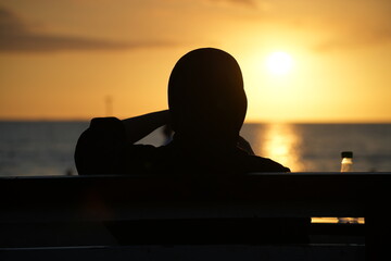 Enjoy the beauty of the sunset on the beach, with a silhouette effect